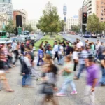 timelapse photo of people passing the street